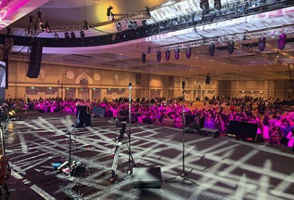 Stage in front of audience with microphones