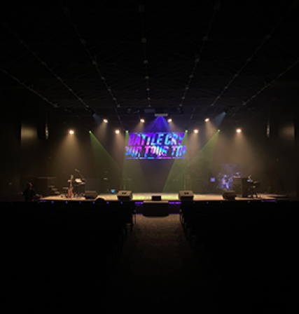 Event stage with lime light beams and haze