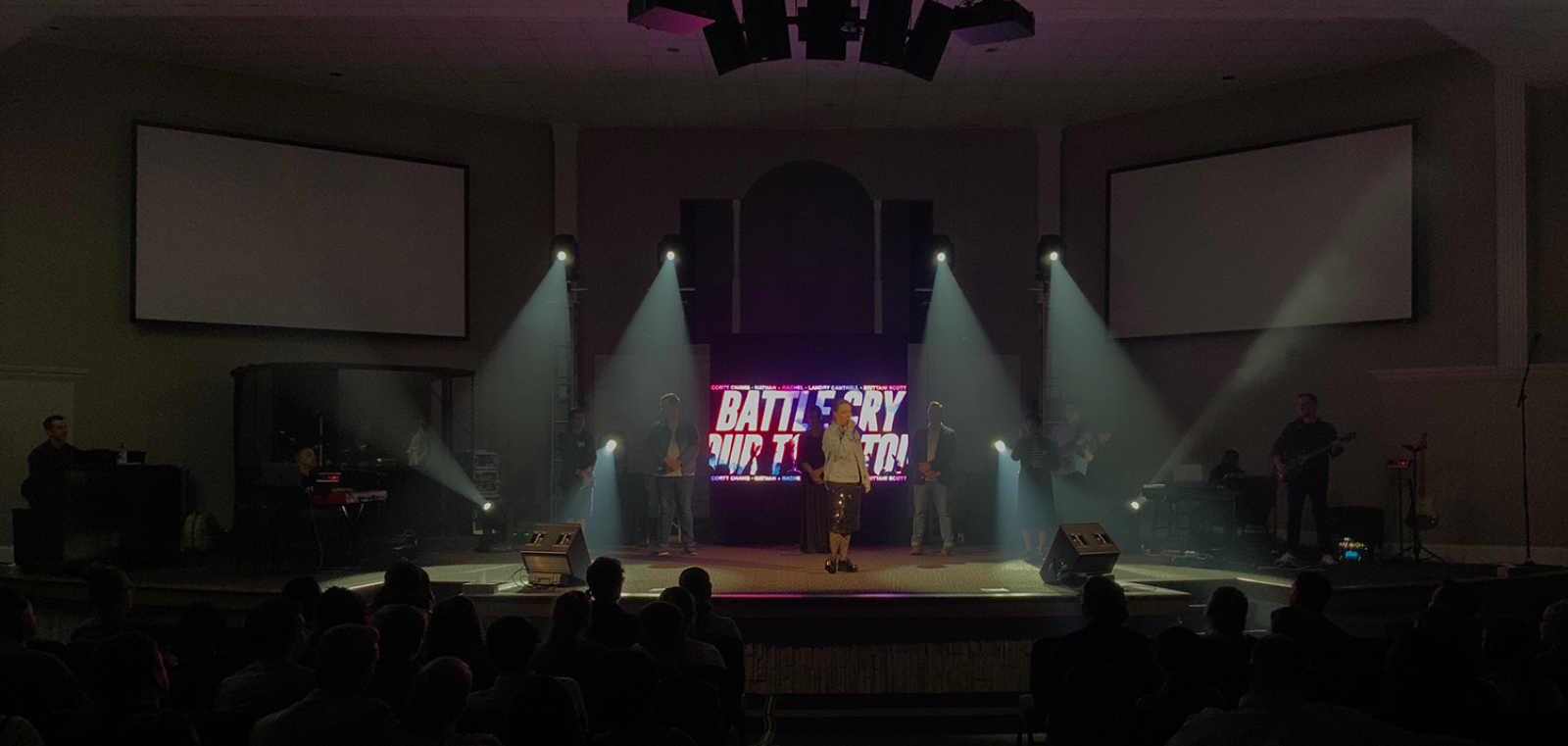 Stage lighting with performers on stage
