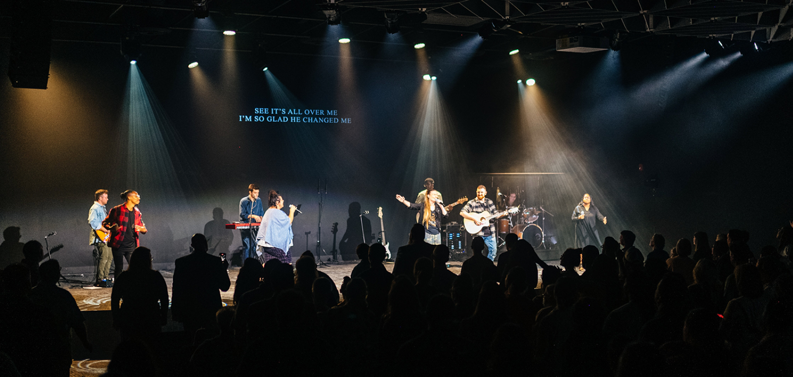 Church stage with musicians performing in front of audience