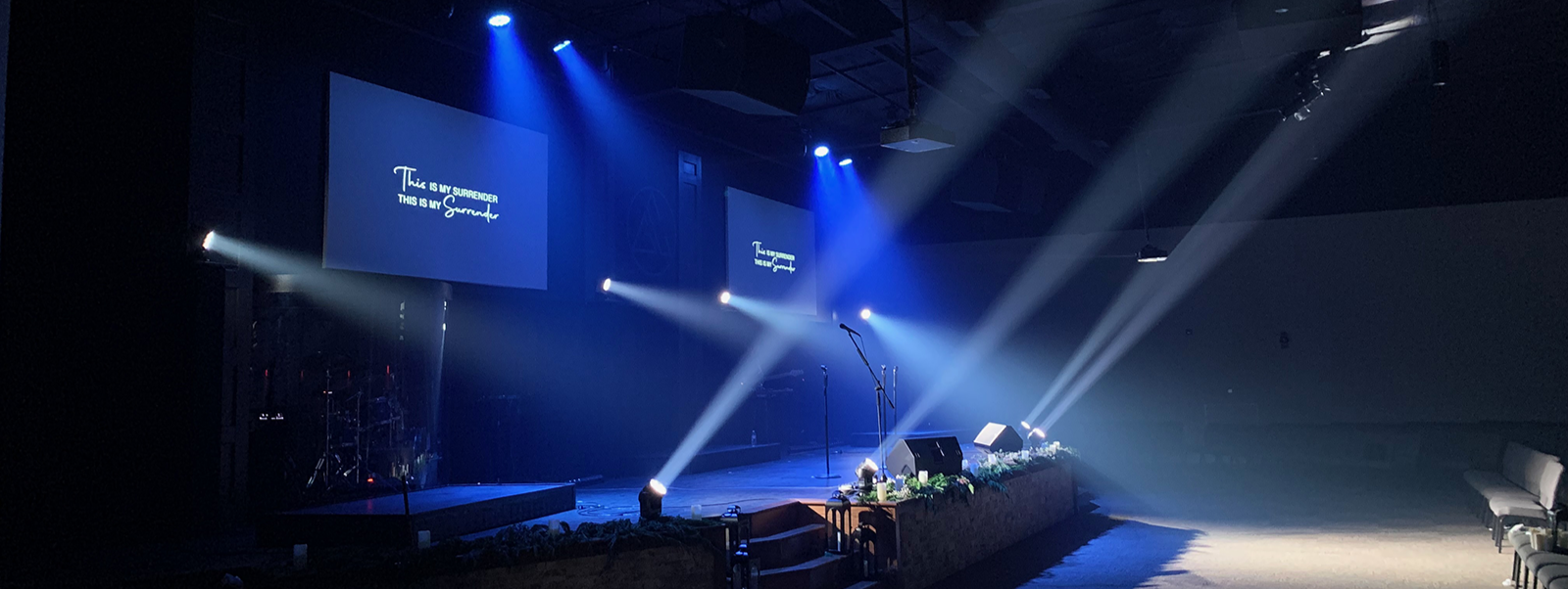 Modern stage for band performance with blue and white lighting